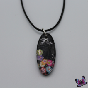 Black resin oval floral pendent