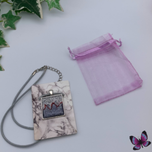 silver and blue glitter square pendent